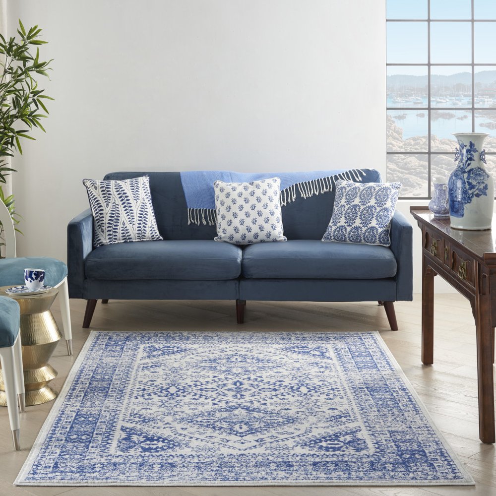 5' X 7' Ivory And Blue Geometric Distressed Area Rug