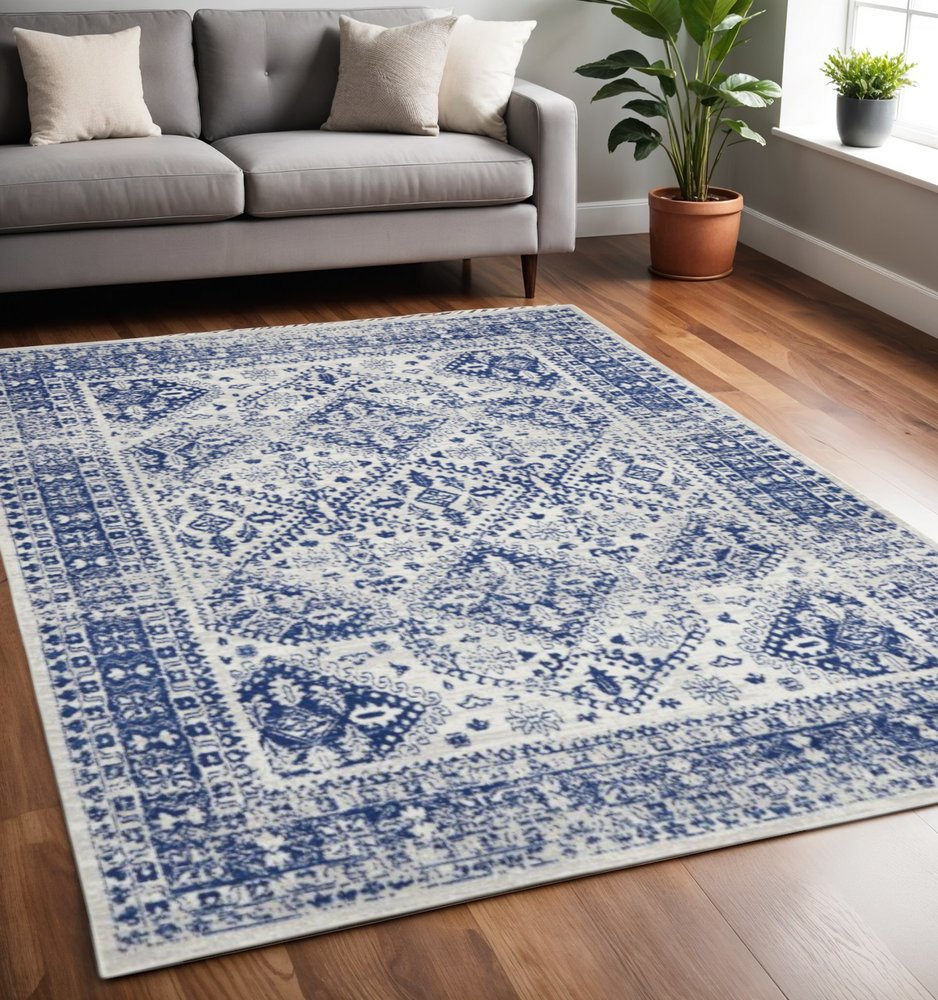5' X 7' Ivory And Blue Geometric Distressed Area Rug
