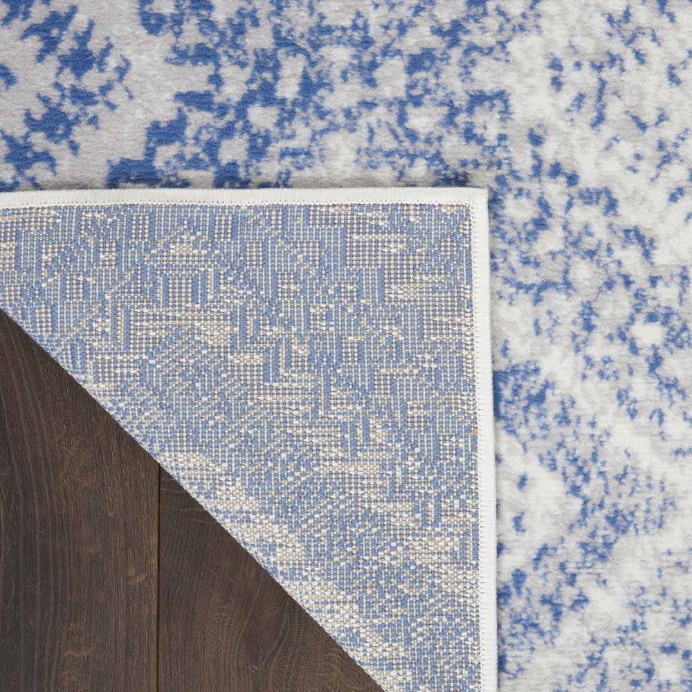 5' X 7' Ivory And Blue Geometric Area Rug