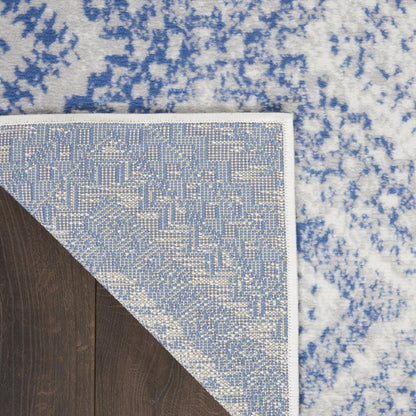 5' X 7' Ivory And Blue Geometric Area Rug