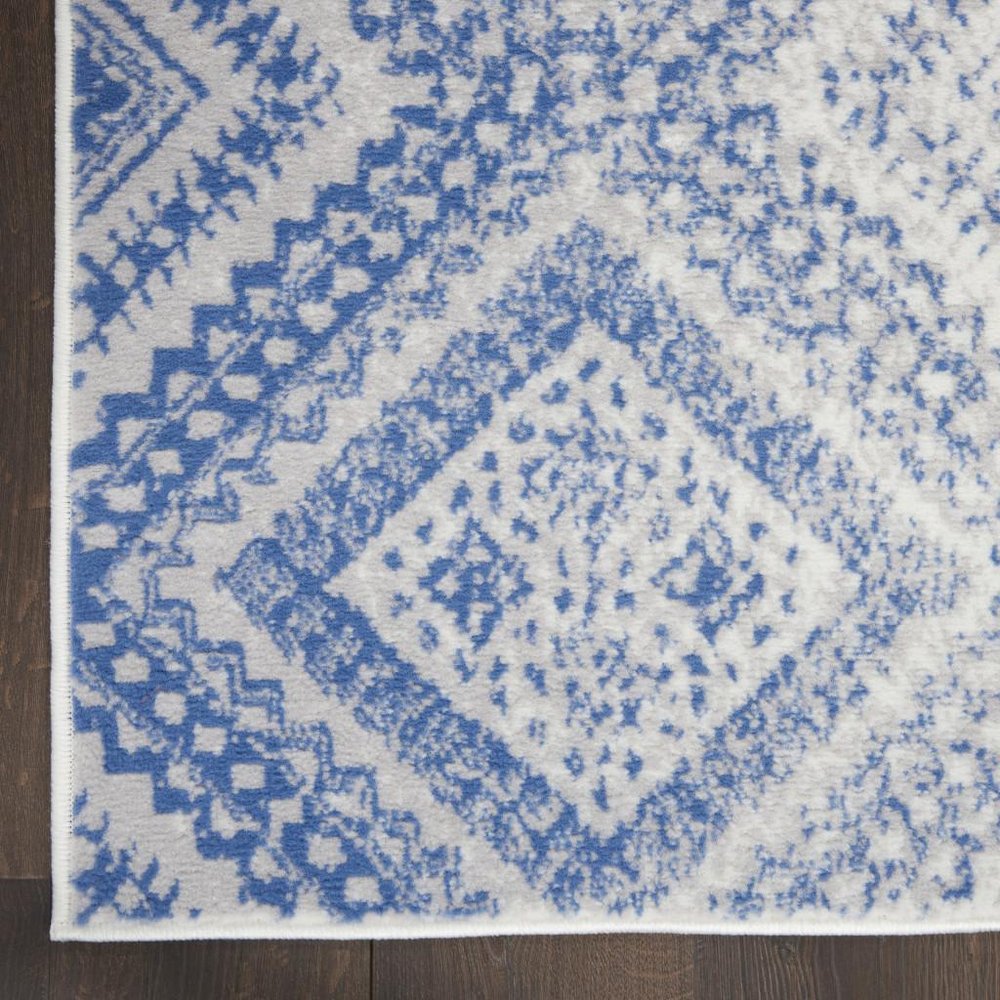 5' X 7' Ivory And Blue Geometric Area Rug
