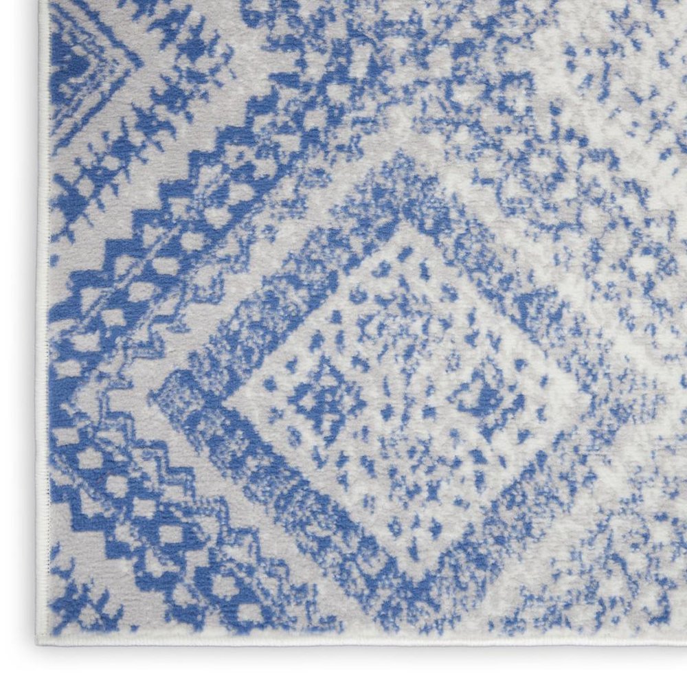 5' X 7' Ivory And Blue Geometric Area Rug