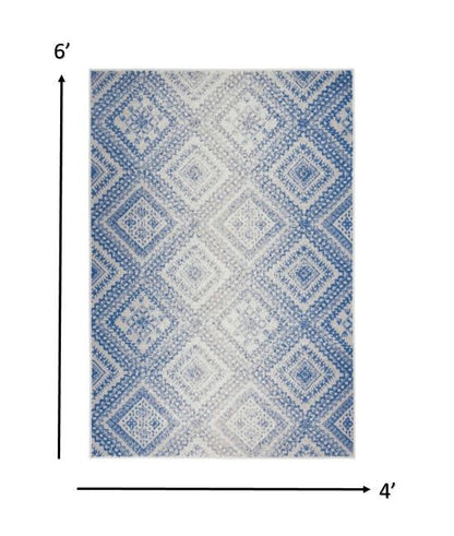 4' X 6' Ivory And Blue Geometric Area Rug