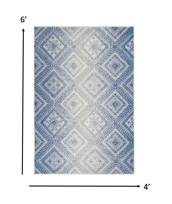 4' X 6' Ivory And Blue Geometric Area Rug