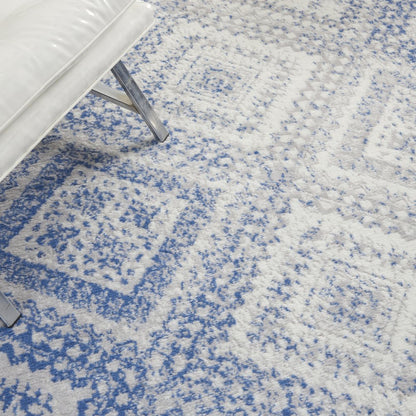 6' X 9' Ivory And Blue Geometric Area Rug
