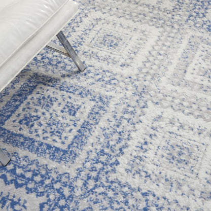 5' X 7' Ivory And Blue Geometric Area Rug