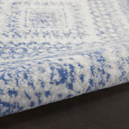 5' X 7' Ivory And Blue Geometric Area Rug