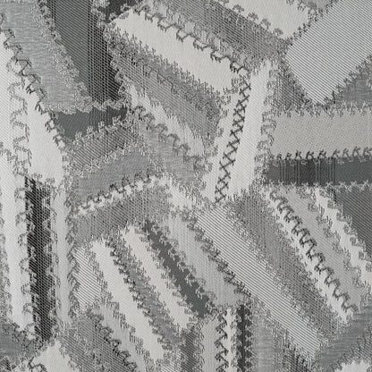 Charcoal and white patchwork pillow with fabric strips, zigzag overlock seams and textured weave, 24" x 24