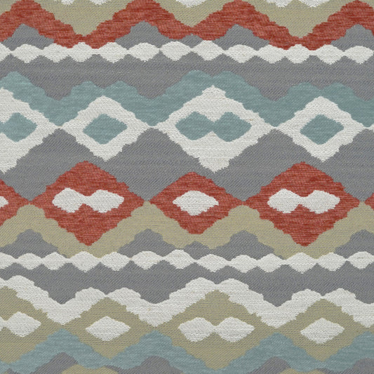 Ikat-inspired geometric fabric with stacked diamond motifs in rust, olive, teal, taupe and ivory; boho textile.