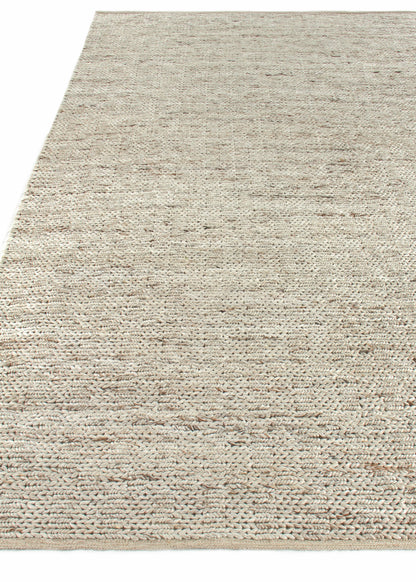 Natural beige handwoven jute rug, rectangular with textured loops, coastal style for living or dining areas.