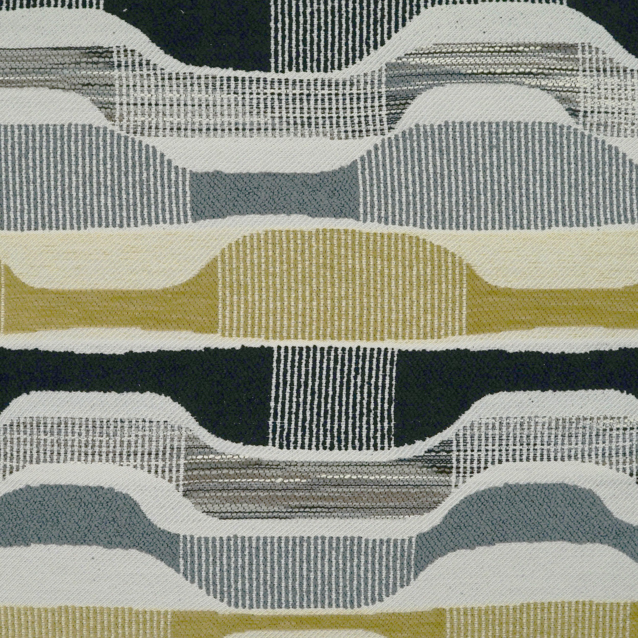 Woven upholstery fabric with abstract layered waves and vertical stripes in black, gray, blue, white, and mustard.