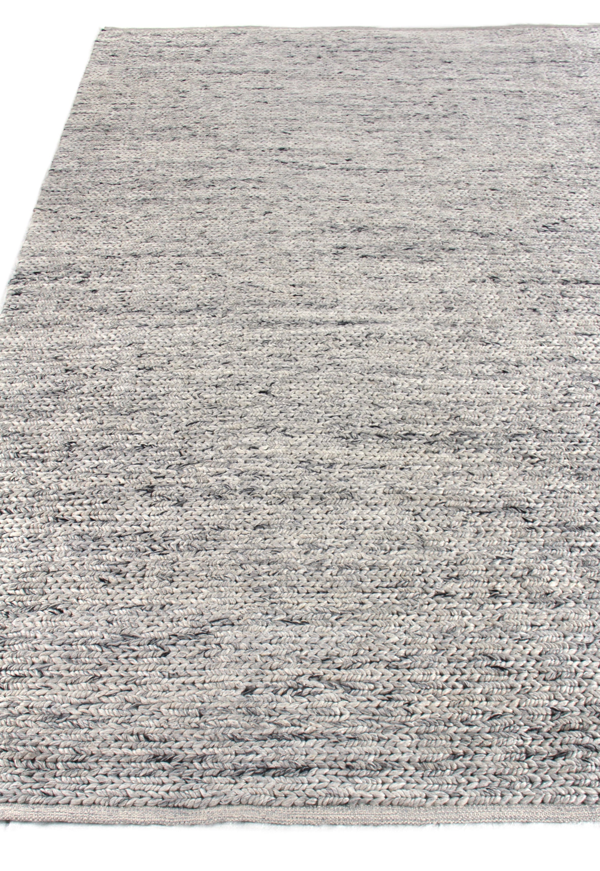 Gray speckled hand-woven rug with subtle blue/charcoal flecks; neutral, versatile living-room accent.
