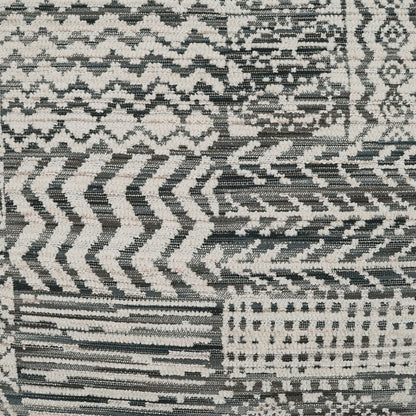 Grey, black and ivory geometric patchwork pillow, 24" x 24", with chevrons, zigzags and grid patterns; woven fabric.