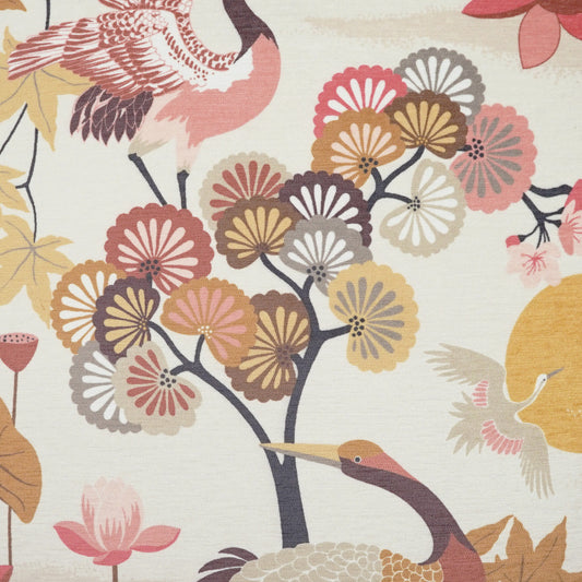 Fabric print on cream: stylized cranes among colorful chrysanthemum blossoms in pink, yellow, mauve.