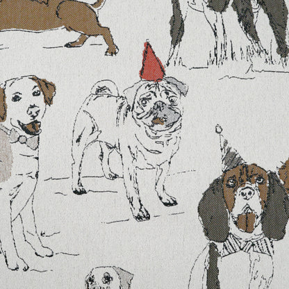 Light fabric with cartoon dogs in snow; white, brown and brindle pups, one wearing a red party hat.