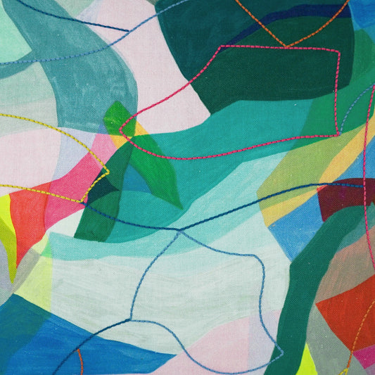 Abstract colorful fabric with overlapping geometric shapes and bright stitched outlines in pink, blue, yellow.