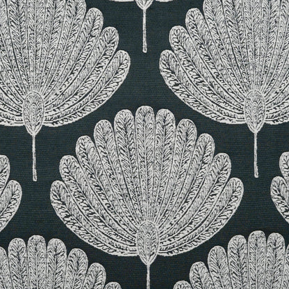 Dark pillow fabric with a repeating white palm-leaf fan motif.
