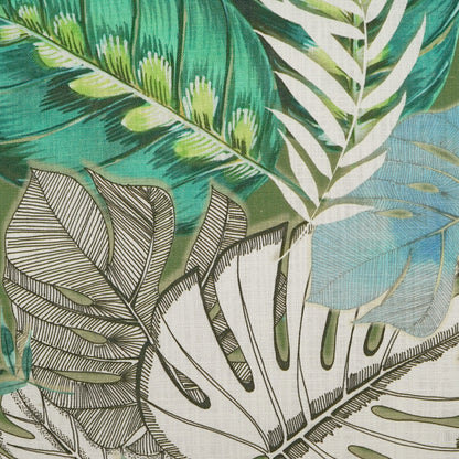 Pillow with tropical leaf pattern featuring white monstera and green palm leaves on teal background with bold black linework.