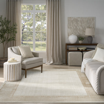 Neutral living room with beige curtains, cream striped armchair, round ribbed side table, large window view, light modern 8' x 10' rug, sofa.
