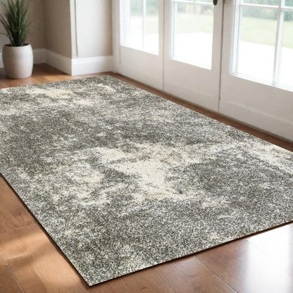 5' X 8' Gray And Ivory Distressed Abstract Area Rug