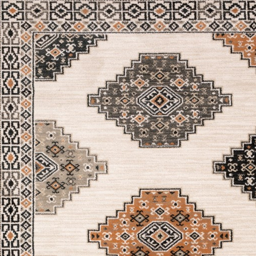 4' X 6' Ivory Black Orange And Gray Geometric Area Rug