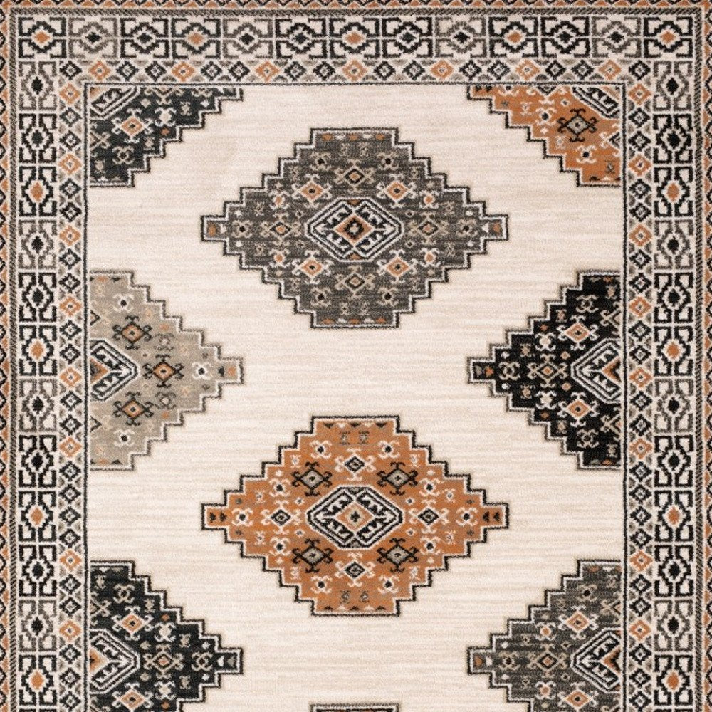 4' X 6' Ivory Black Orange And Gray Geometric Area Rug