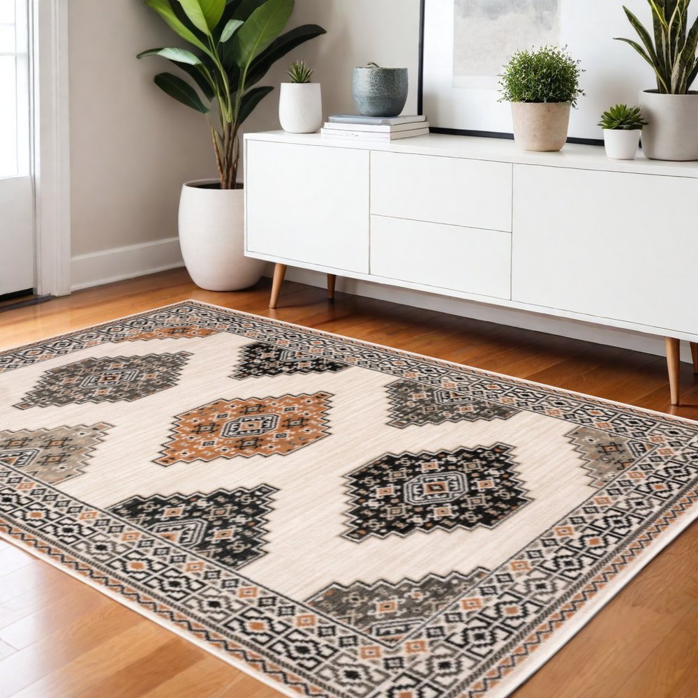 4' X 6' Ivory Black Orange And Gray Geometric Area Rug