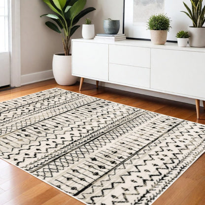 5' X 7' Ivory And Black Abstract Geometric Distressed Area Rug