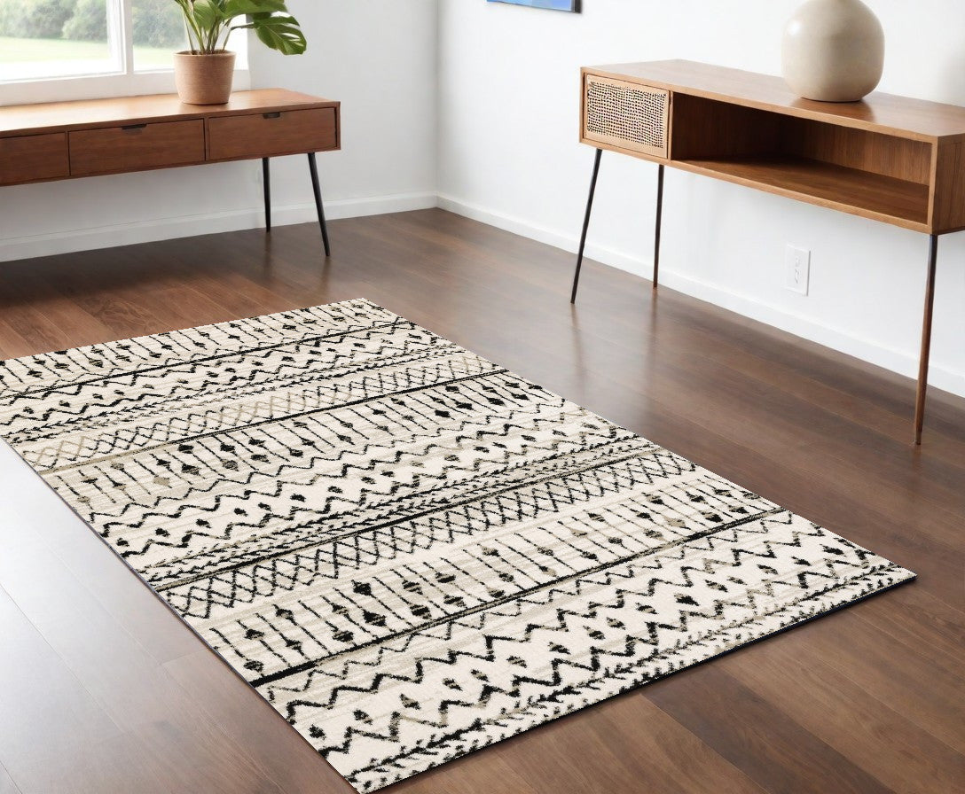 5' X 7' Ivory And Black Eclectic Patterns Indoor Area Rug