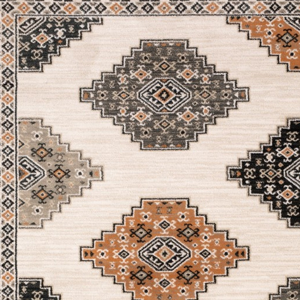 4' X 6' Ivory Black Orange And Gray Geometric Area Rug