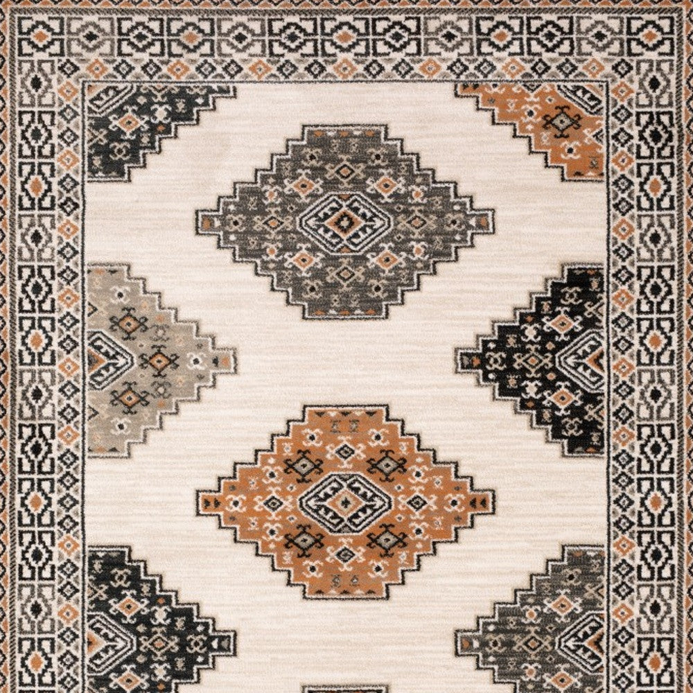 4' X 6' Ivory Black Orange And Gray Geometric Area Rug
