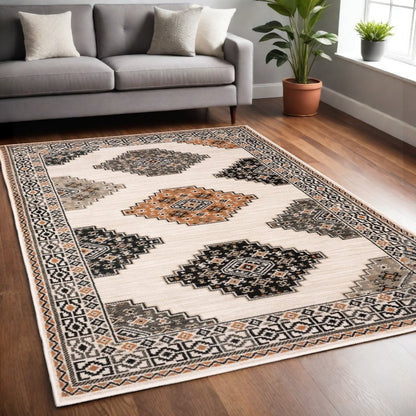 4' X 6' Ivory Black Orange And Gray Geometric Area Rug