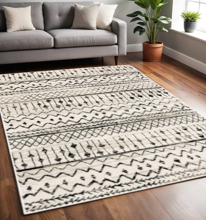 4' X 6' Ivory And Black Eclectic Patterns Indoor Area Rug