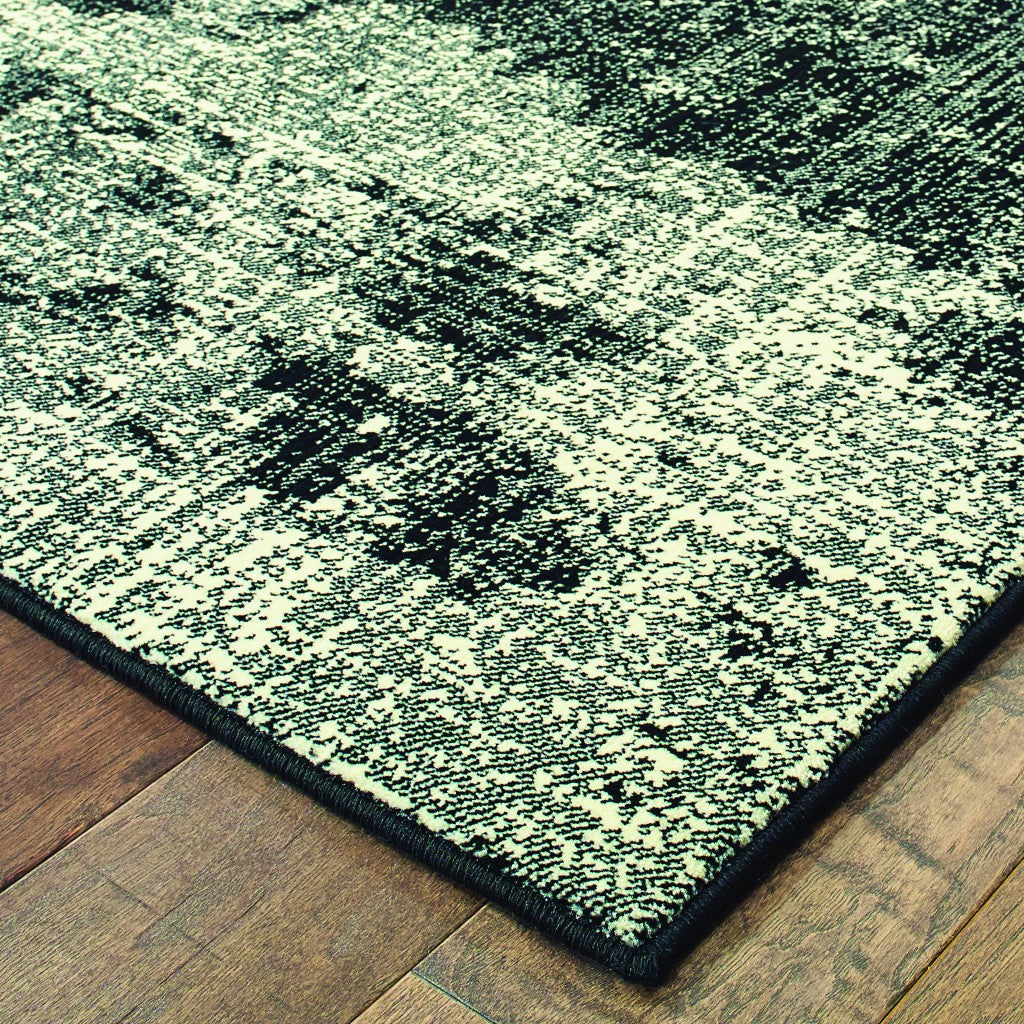 5' X 8' Black Ivory Machine Woven Abstract Indoor Area Rug