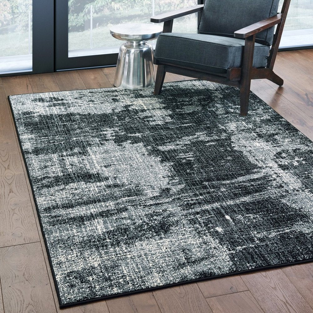 10' X 13' Black And Ivory Abstract Distressed Area Rug