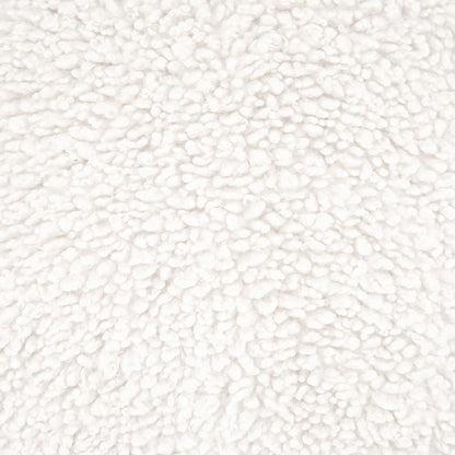 Cream faux fur pillow close-up with fluffy, plush pile.