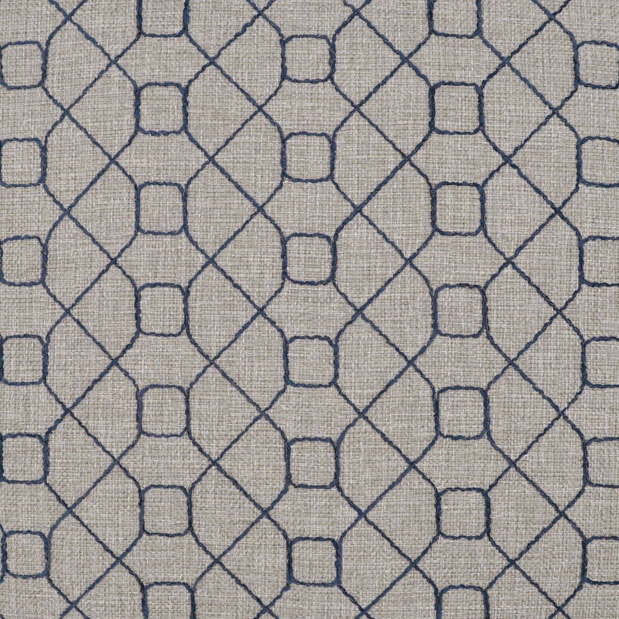 Beige linen-like fabric with navy blue diamond lattice pattern and small square accents; textured weave.