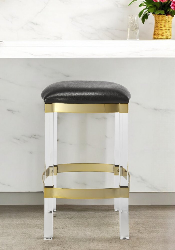 24-inch backless counter-height bar chair with a black and clear seat and a stainless steel frame.