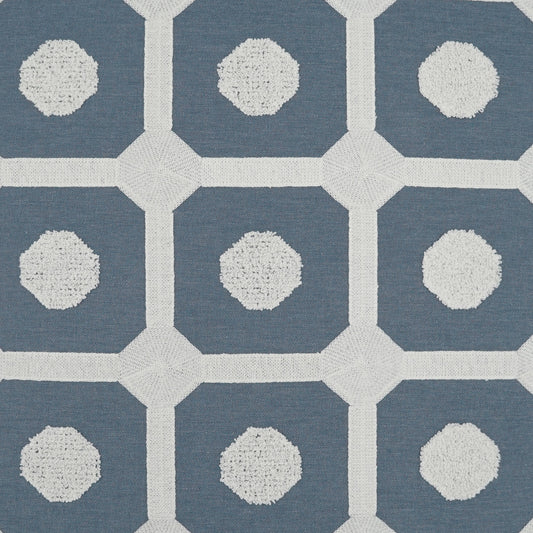 Blue fabric with a white lattice grid and pale textured circles in each cell; modern geometric pattern.