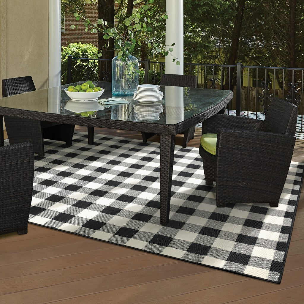 2' X 8' Black and Ivory Indoor Outdoor Area Rug