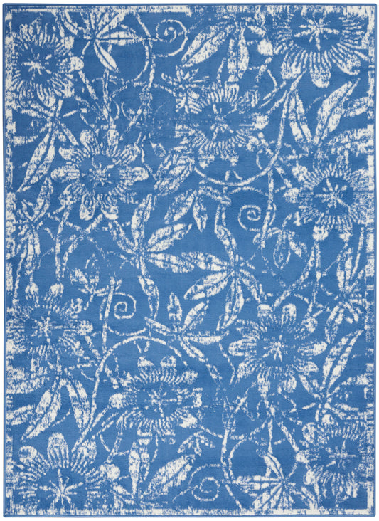 Blue fabric with white damask floral pattern; scrolling vines and blossoms for curtains, wallpaper, or decor.