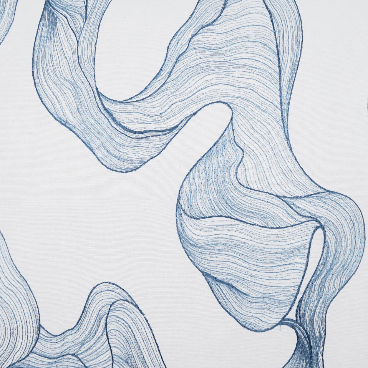 Blue abstract fabric folds with flowing, ribbon-like lines; soft textile art.