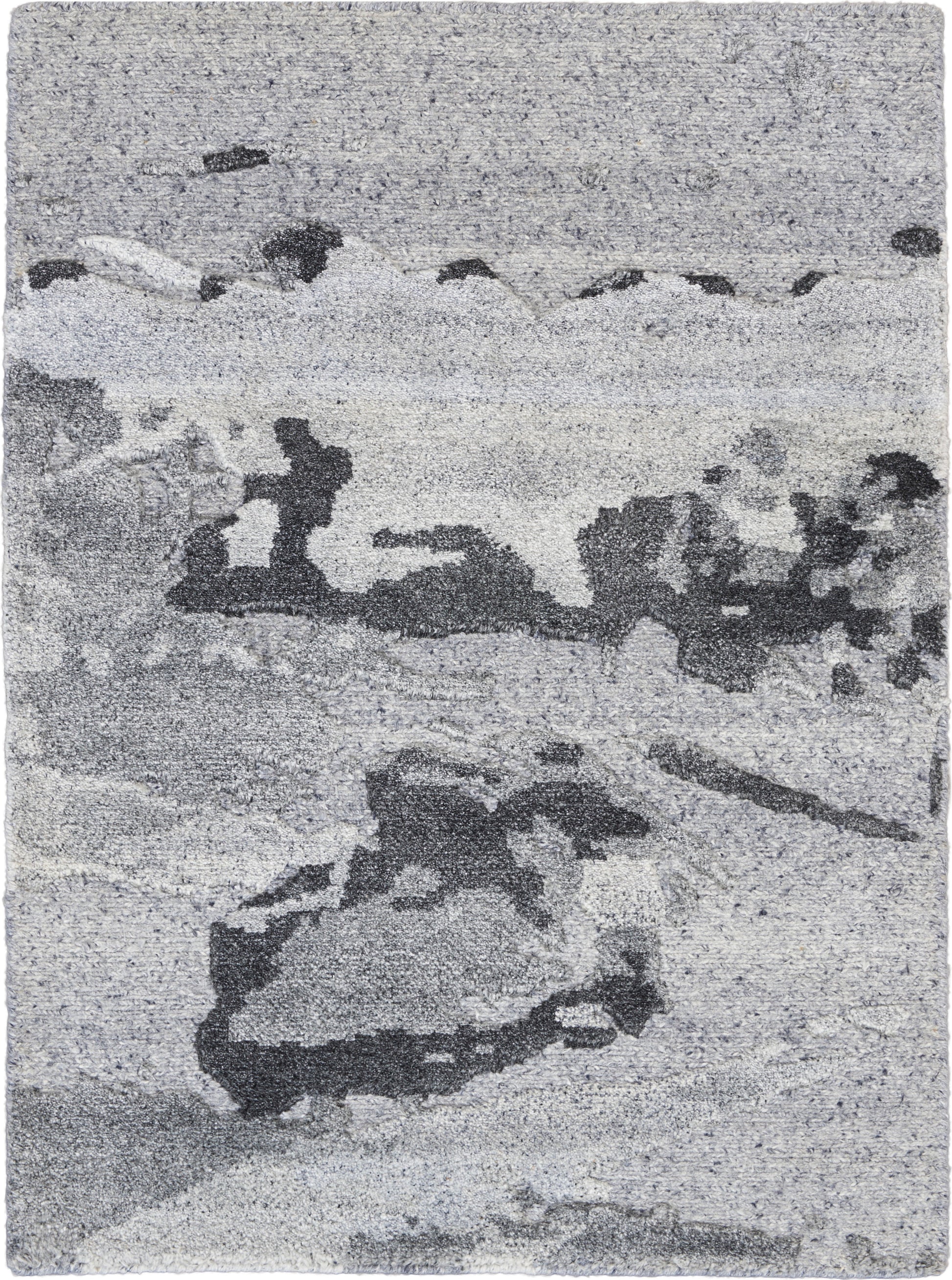 Gray-toned abstract seascape rug with rocky shoreline & waves, soft textured appearance.