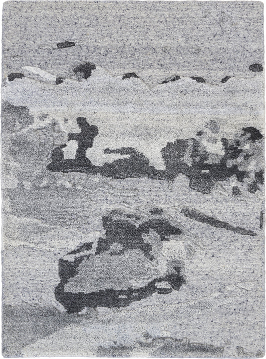 Gray-toned abstract seascape rug with rocky shoreline & waves, soft textured appearance.