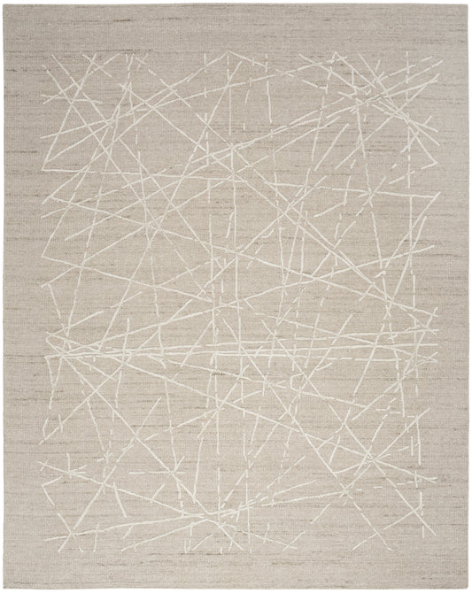 Beige flatweave rug with white abstract crisscross lines; modern geometric accent for living spaces.