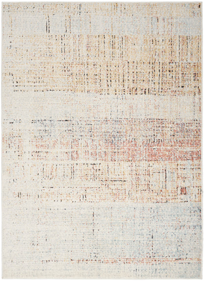 Rectangular abstract distressed area rug in cream, pale blue and peach with rust accents; modern, soft woven feel.