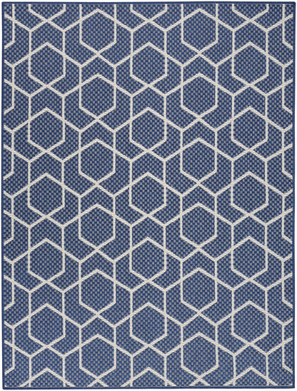 Blue rug with white hexagon lattice pattern, woven texture, modern geometric decor for living room.