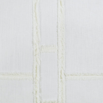 White fabric pillow with pale cream embroidered grid forming rectangular panels; soft, quilted textile look.