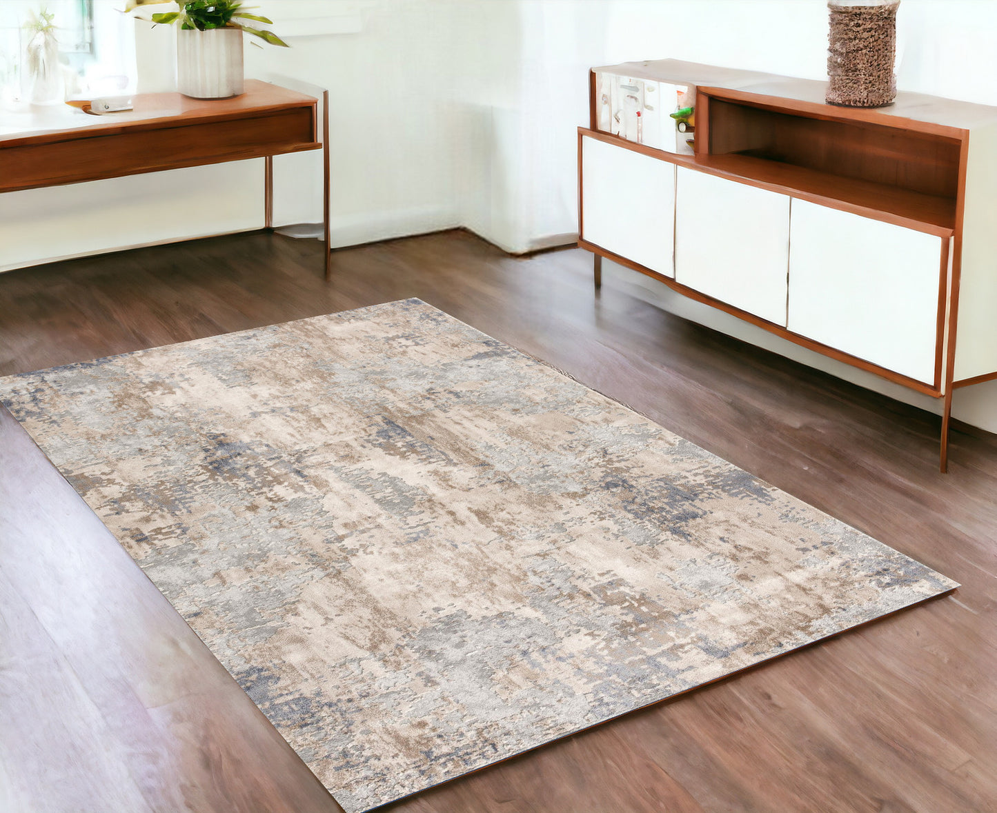 7’ X 10’ Beige And Ivory Abstract Area Rug