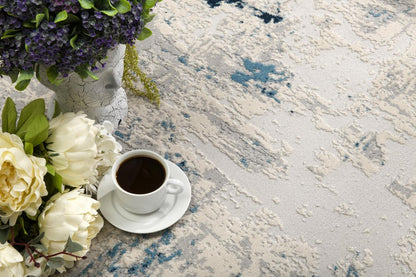 5' X 8' Blue And Ivory Abstract Strokes Area Rug